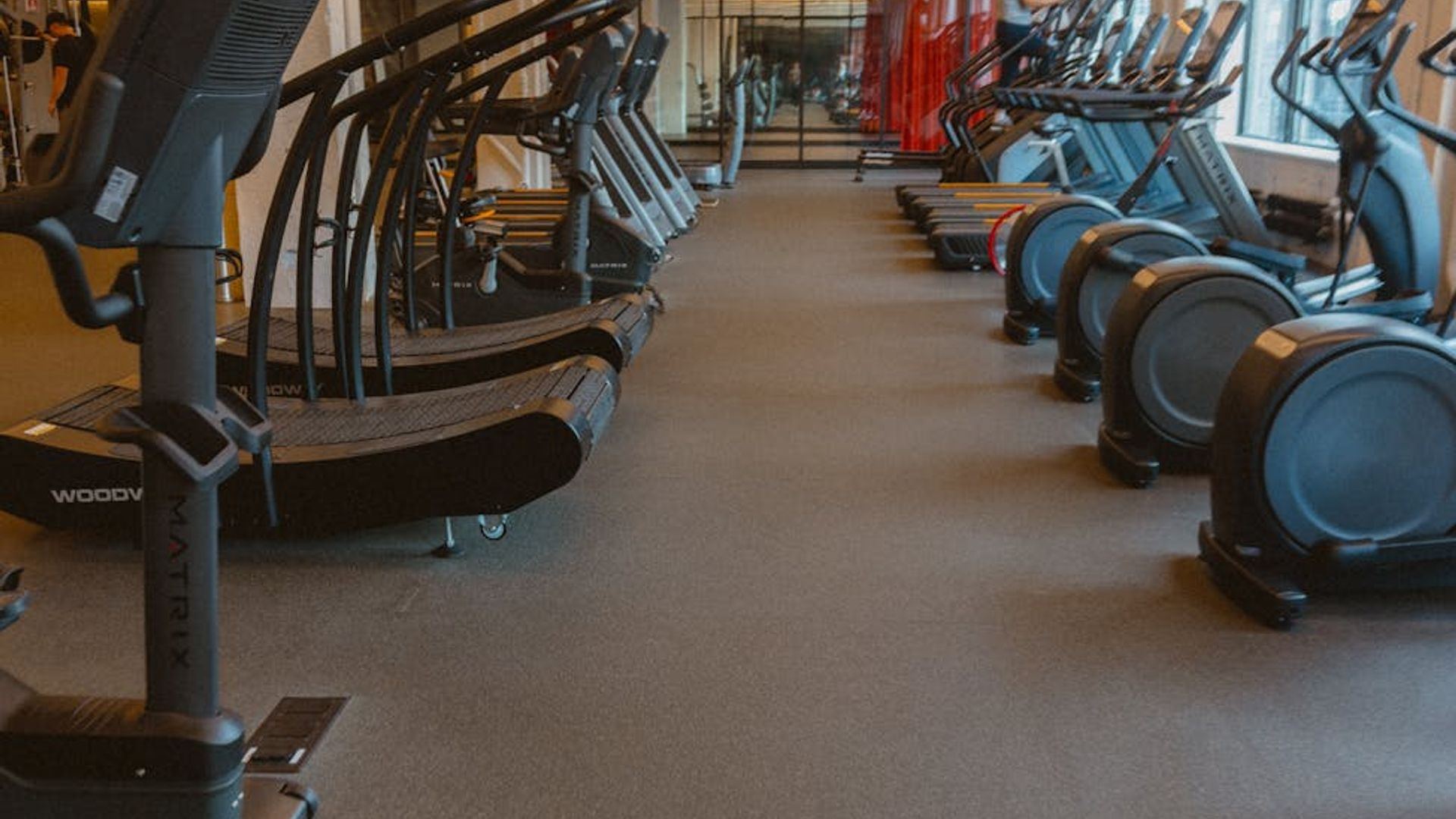 Person doing light cardio in a bright spacious room